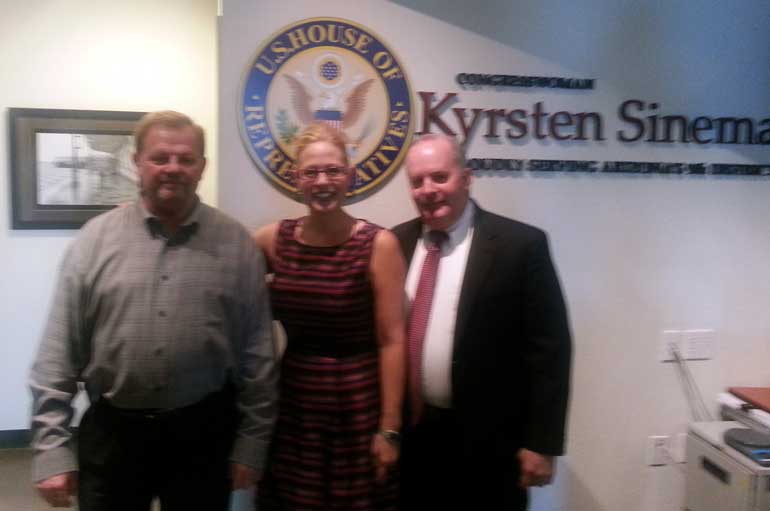 Jim Bennett, LUTCF (left) NAIFA-Arizona National Committee Chair and IFAPAC Chair. U.S. Congresswoman Kyrsten Sinema William Cassidy, CLU, ChFC, NAIFA-Phoenix IFAPAC Chair